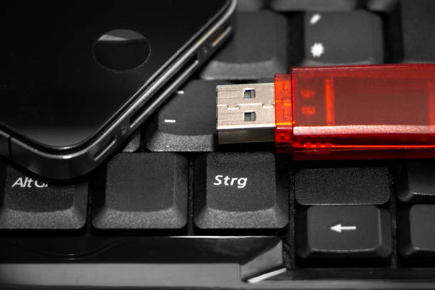 istock USB stick and smartphone on laptop 1208765646