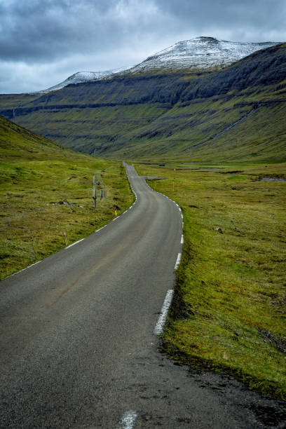 Moody scene of empty remote road in Faroe Islands. stock photo