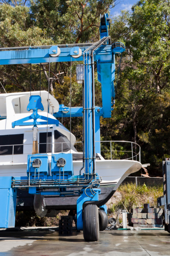 motor yacht in the shipyard ready for repairs, full frame vertical composition