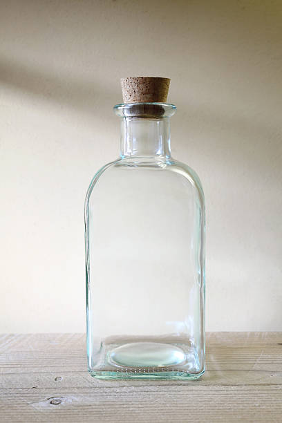 istock Glass buttle on wooden table 120876789