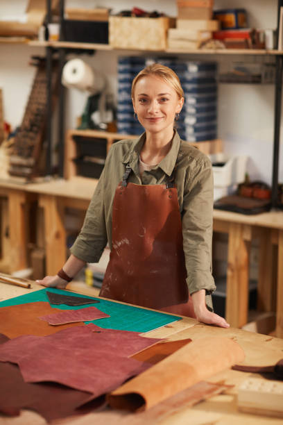 istock Cheerful Craftswoman Looking At Camera 1208768103