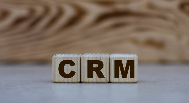 istock concept word CRM on cubes on a beautiful wooden background 1208769650