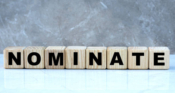 istock concept word nominate on cubes on a beautiful gray background 1208769780