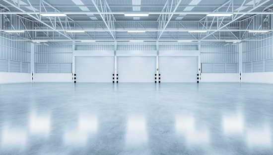 3d rendering of shutter door and concrete floor inside warehouse building for industrial background.