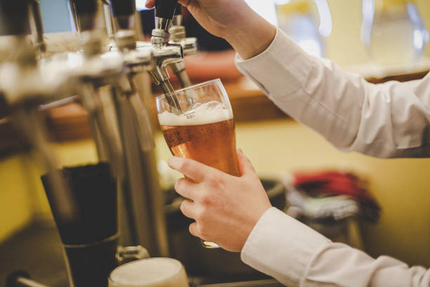 istock A hand holding a glass of beer 1208770789