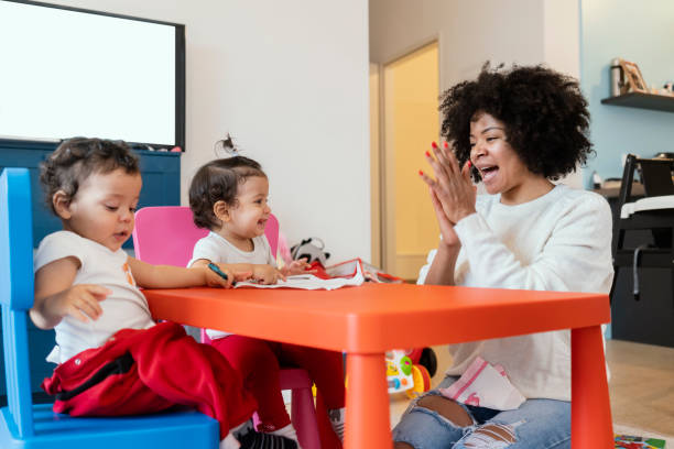 istock Mom and babies at home 1208773584