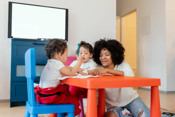 istock Mom and babies at home 1208773645