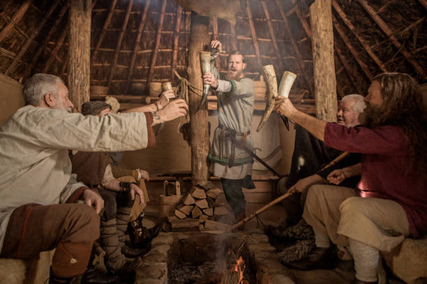 A group of viking men in a viking village settlement A group of viking men posing for a group pic in an authentic viking settlement village setting live action role playing photos stock pictures, royalty-free photos & images
