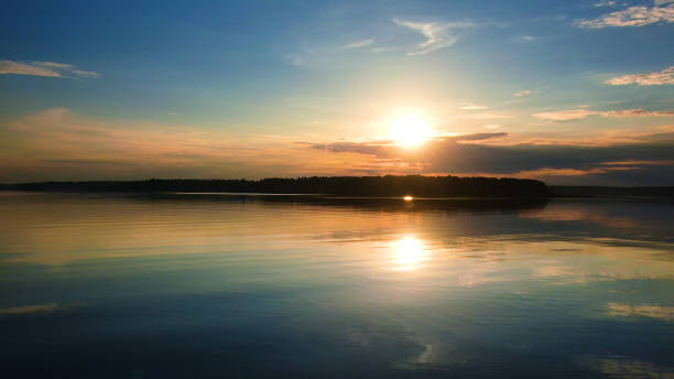 istock Beautiful scenery. Lake at sunset. 1208774907