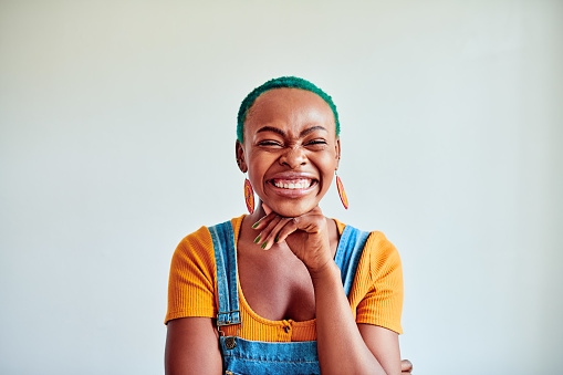 Cropped shot of a beautiful young woman posing against a white background