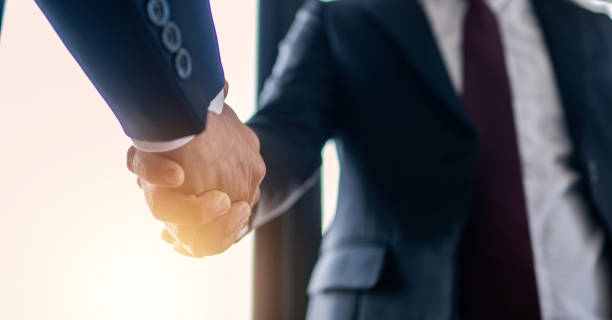 istock successful negotiate and handshake concept, two businessman shake hand with partner to celebration partnership and teamwork, business deal 1208776436