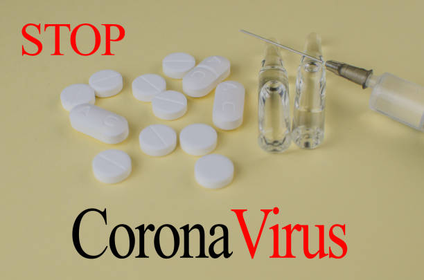 istock Stop coronavirus 2019. Injections, virus pills. Background. Text stop virus 1208779613