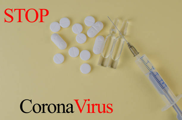 istock Stop coronavirus 2019. Injections, virus pills. Background. Text stop virus 1208780748
