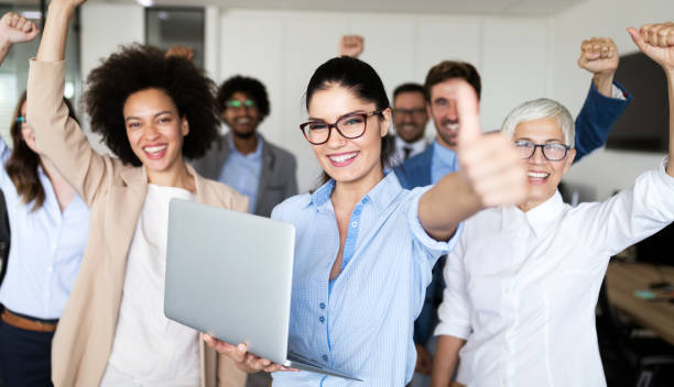 istock Successful company with happy workers in office 1208781688