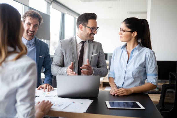 istock Group of successful business people at work in office 1208782343