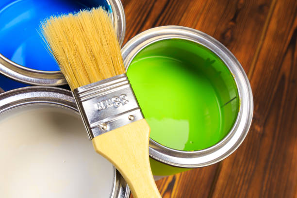 istock House renovation, paint cans on the old wooden background with copy space 1208783614