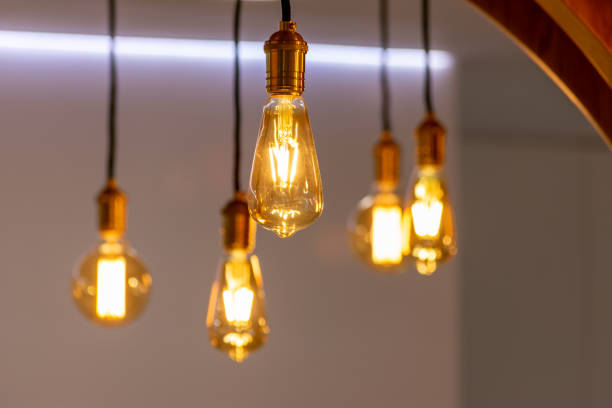 istock elegant modern illuminated light bulb in office reception 1208787381
