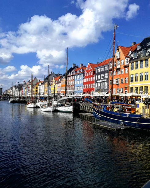 istock Boats with colorful houses behind 1208793726