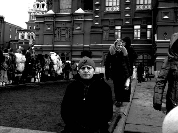 Moscow, Russia - February 24, 2020: Toutists and perfomers on Manegnaya Square