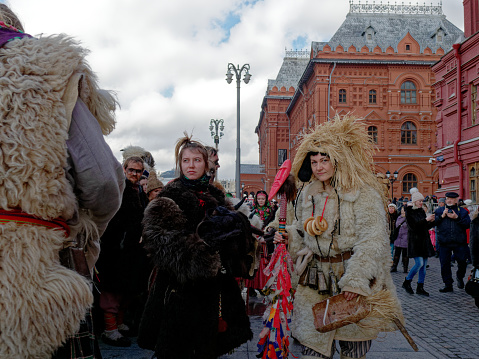Moscow, Russia - February 24, 2020: Toutists and perfomers on Manegnaya Square