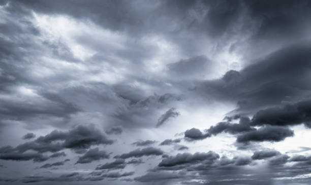 istock Dark dramatic sky and clouds. Background for death and sad concept. Gray sky and fluffy white clouds. Thunder and storm sky. Sad and moody sky. Nature background. Dead abstract background. Cloudscape. 1208799638