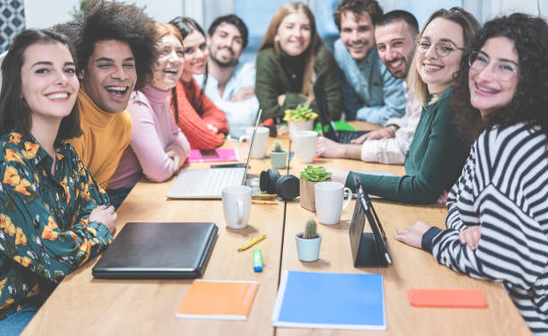 istock Young co-workers team talking during startup - Happy people planning a new project in creative coworking office - Technology, entrepreneur, marketing concept - Focus on right blond girl face 1208800885