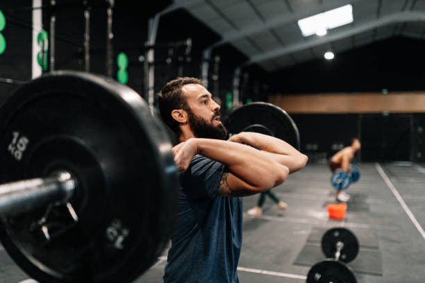 istock Young male weightlifter exercising in gym 1208802476