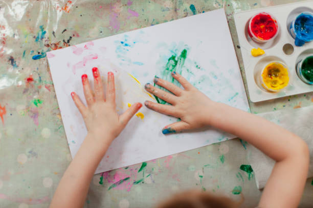 istock Girl Finger Painting 1208803067
