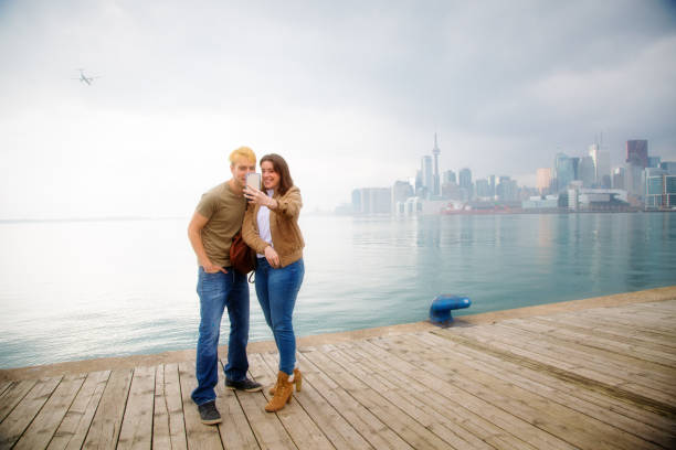 istock Couple with Toronto skyline 1208806612