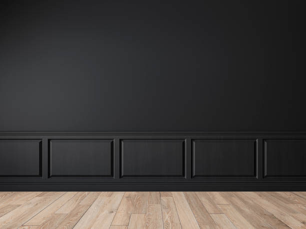istock Modern classic black empty interior with wall panels, molding and wooden floor. 1208806655