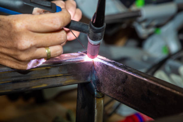 istock Female TIG welder 1208806659