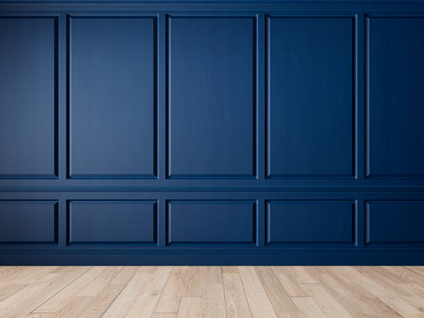 istock Classic blue interior blank wall with panels, moldings and wood floor. 1208806896