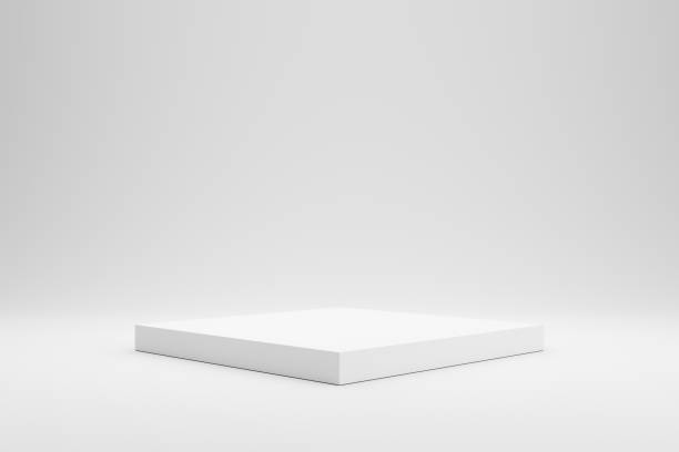 istock Empty podium or pedestal display on white background with box stand concept. Blank product shelf standing backdrop. 3D rendering. 1208807947