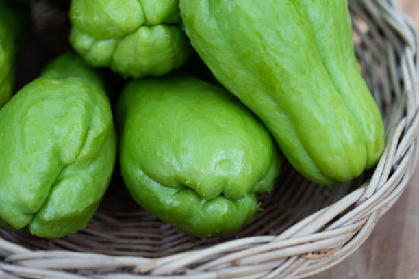 istock Green fresh chayote in bamboo basket for cook. 1208809699