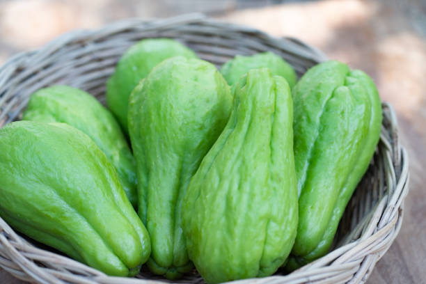 istock Green fresh chayote in bamboo basket for cook. 1208809711