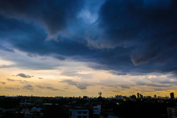 istock Raining cloud over skyscraper of modern city building 1208810556