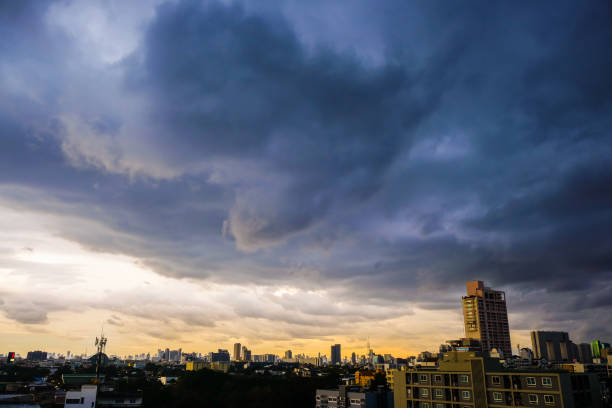 istock Raining cloud over skyscraper of modern city building 1208811250