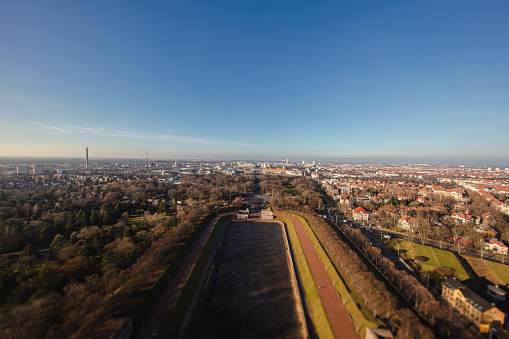 Aerial view over the winter skyline of the city of Leipzig. The monument of the battle of nations casts its shadow over the scenery. Panorama view of Leipzig, Saxony, Germany