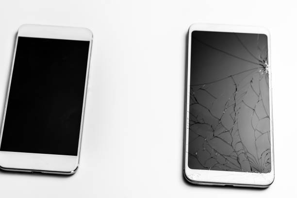 istock Two smartphones, one with broken screen, white background 1208811381