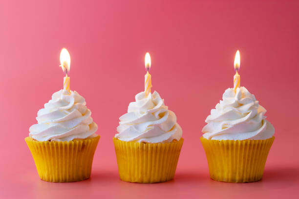 istock Homemade Birthday cupcake on pink Background. 1208812998