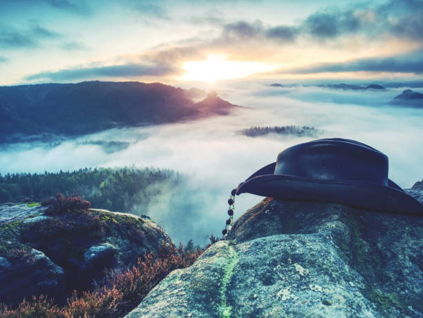 istock American West rodeo cowboy black leather hat on stone. 1208813365