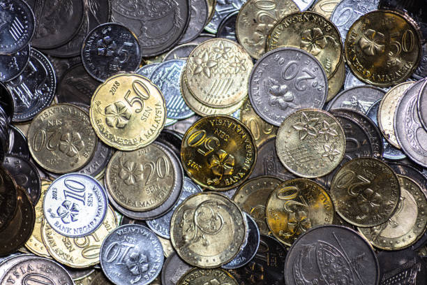 Close uo to 50 Malaysian Ringgit cent Extreme macro photography of 50 Malaysian ringgit cent. The bank negara fifty cent coin of malaysia. Sharp detailed capture of the Malaysia character on the RM 50 sen coin. microscopic picture of this coin coins of ringgit of malaysia stock pictures, royalty-free photos & images