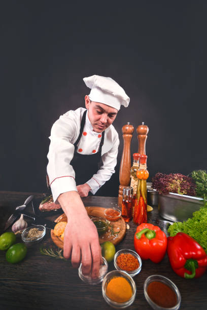 istock Young chef cooking in a cuisine. Vertical composition. 1208817666