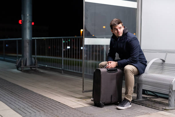 istock Caucasian business man waiting for a train 1208823224
