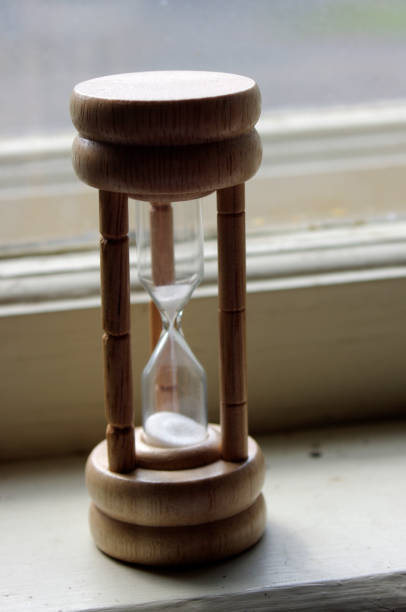 istock antique hourglass with flowing sand 1208823330