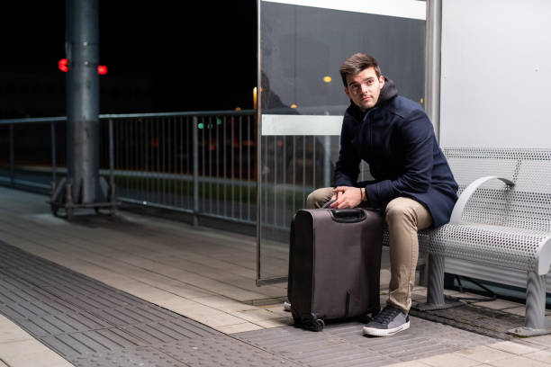 istock Caucasian business man waiting for a train 1208823927