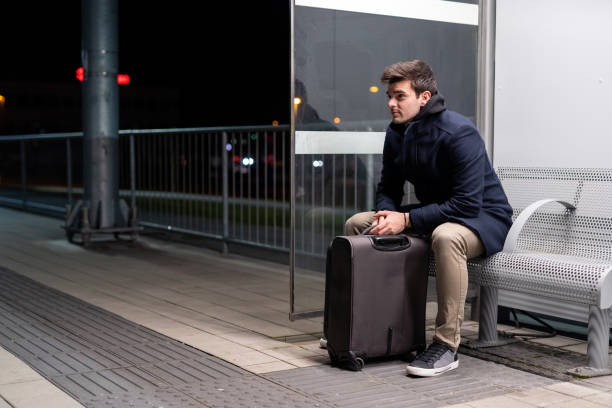 istock Caucasian business man waiting for a train 1208824005