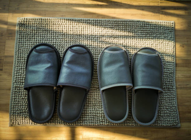 istock Black slippers for wearing in the room. 1208824111