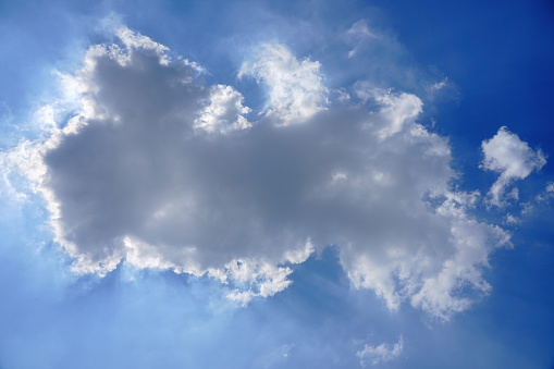 Clouds in blue sky with sun rays light