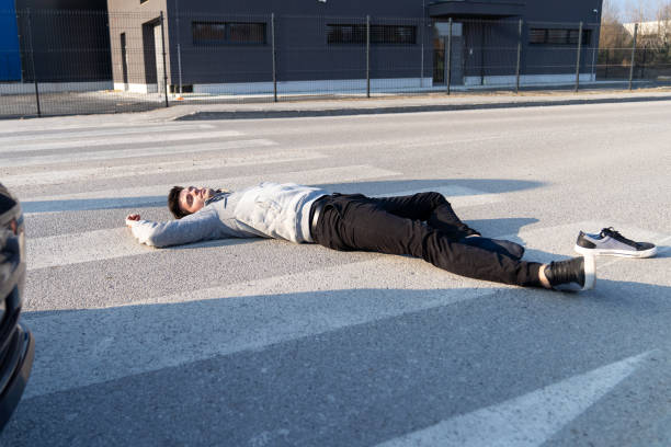 istock Caucasian white man hit by a car on a crosswalk 1208825399